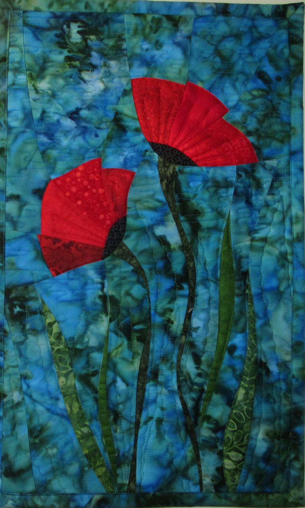Two poppies on blue