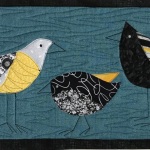 3 silly black and yellow birds