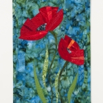 Two poppies on blue